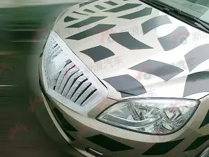 Buick Excelle Sedan: foto spia Opel Astra tre volumi